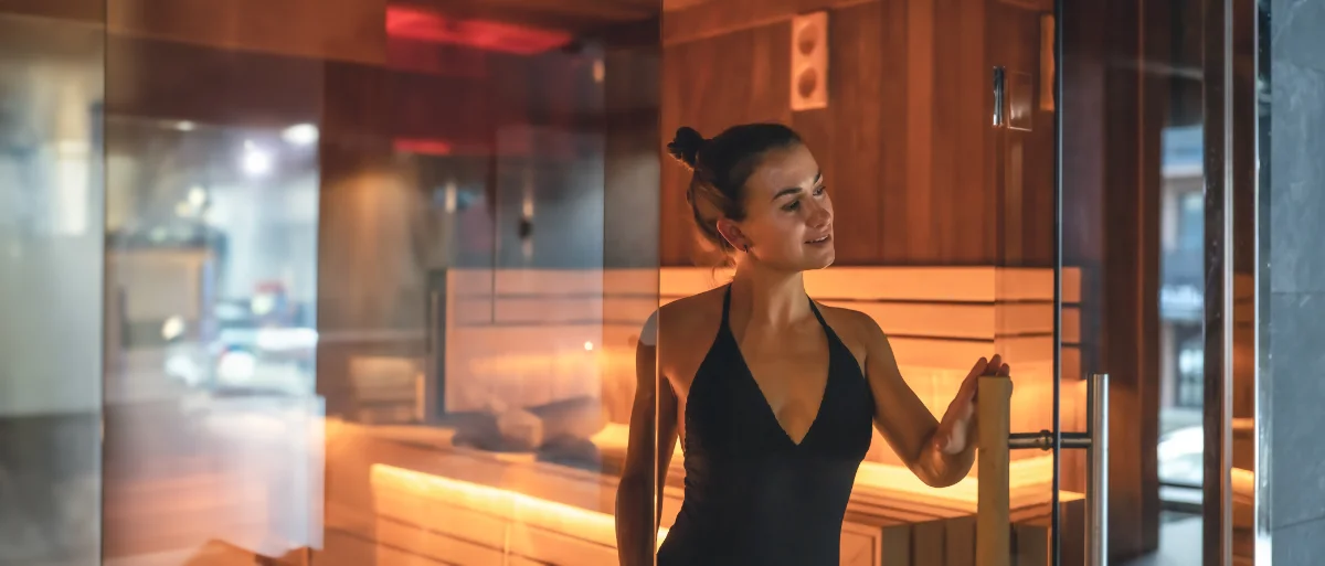 Young woman relaxing in a wood paneled sauna 2026 01 08 23 52 45 utc